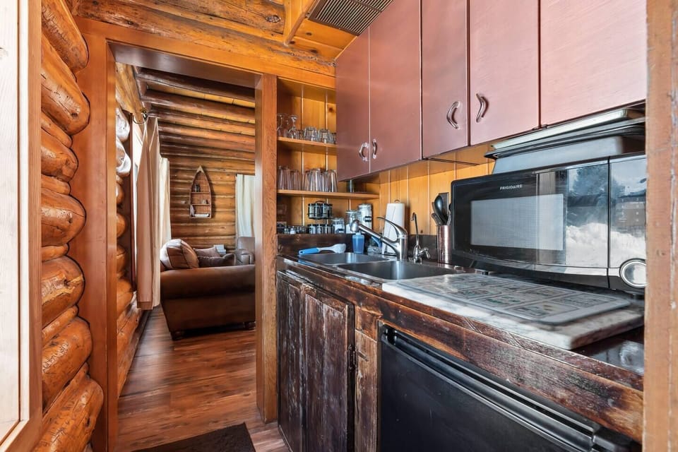Experience culinary convenience with the well-appointed kitchen sink and cabinets, offering a practical and organized space for all your cooking needs.