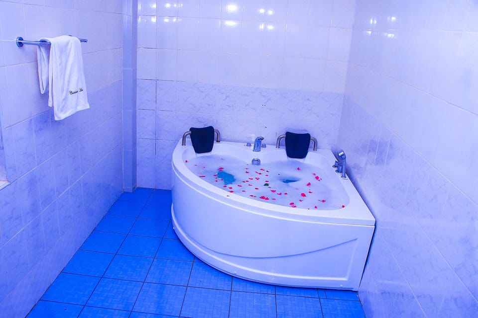 Deep soaking tub, rainfall showerhead, free toiletries, slippers