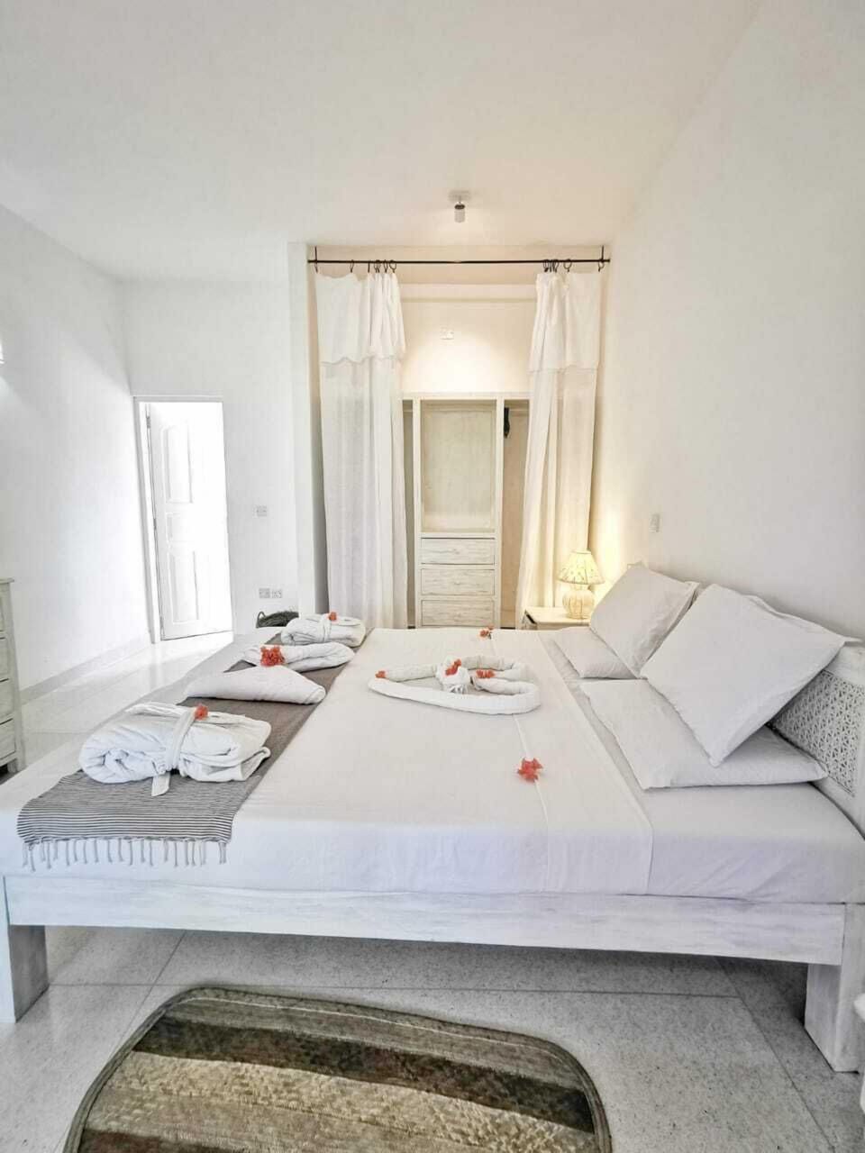 Desk, laptop workspace, bed sheets