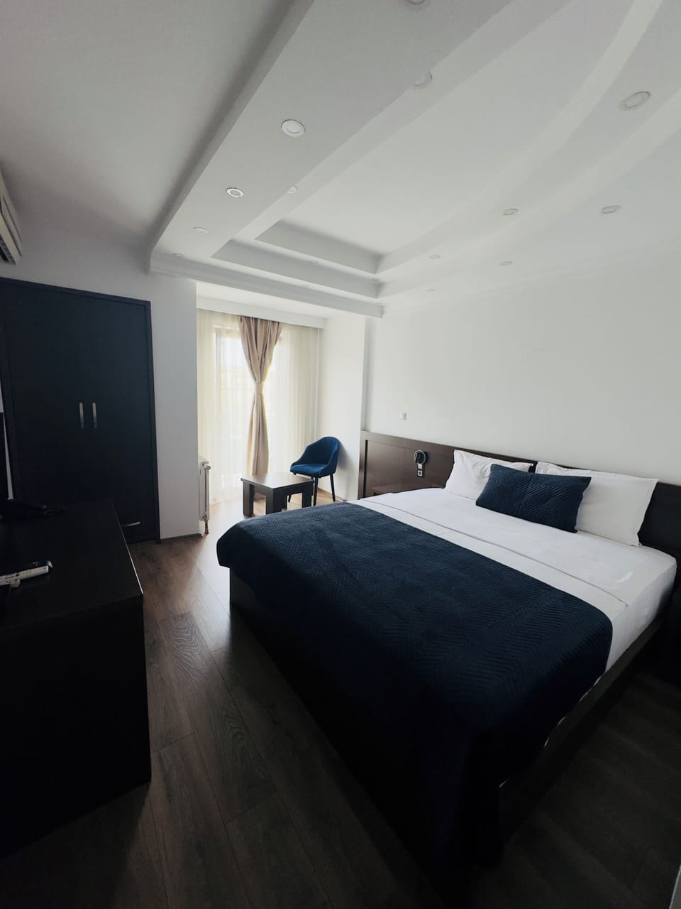 Double Room, Private Bathroom, City View | Minibar, desk, laptop workspace, blackout drapes