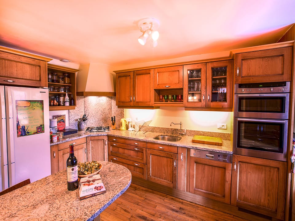 Modern Oak Kitchen with granite counter top and all necessary appliances