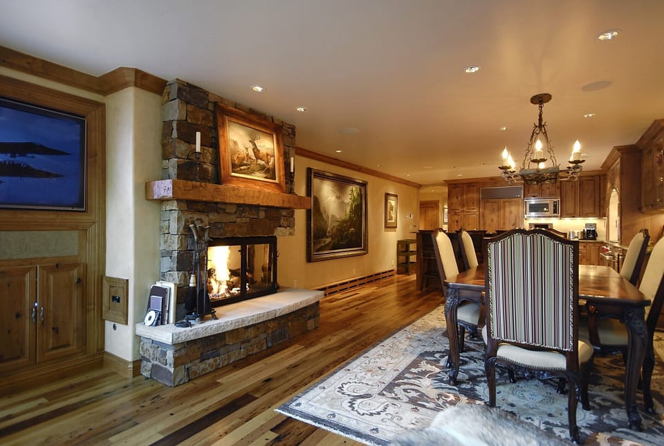 Dining Room with Large Table for 6 people, open floor plan and Fire Place.