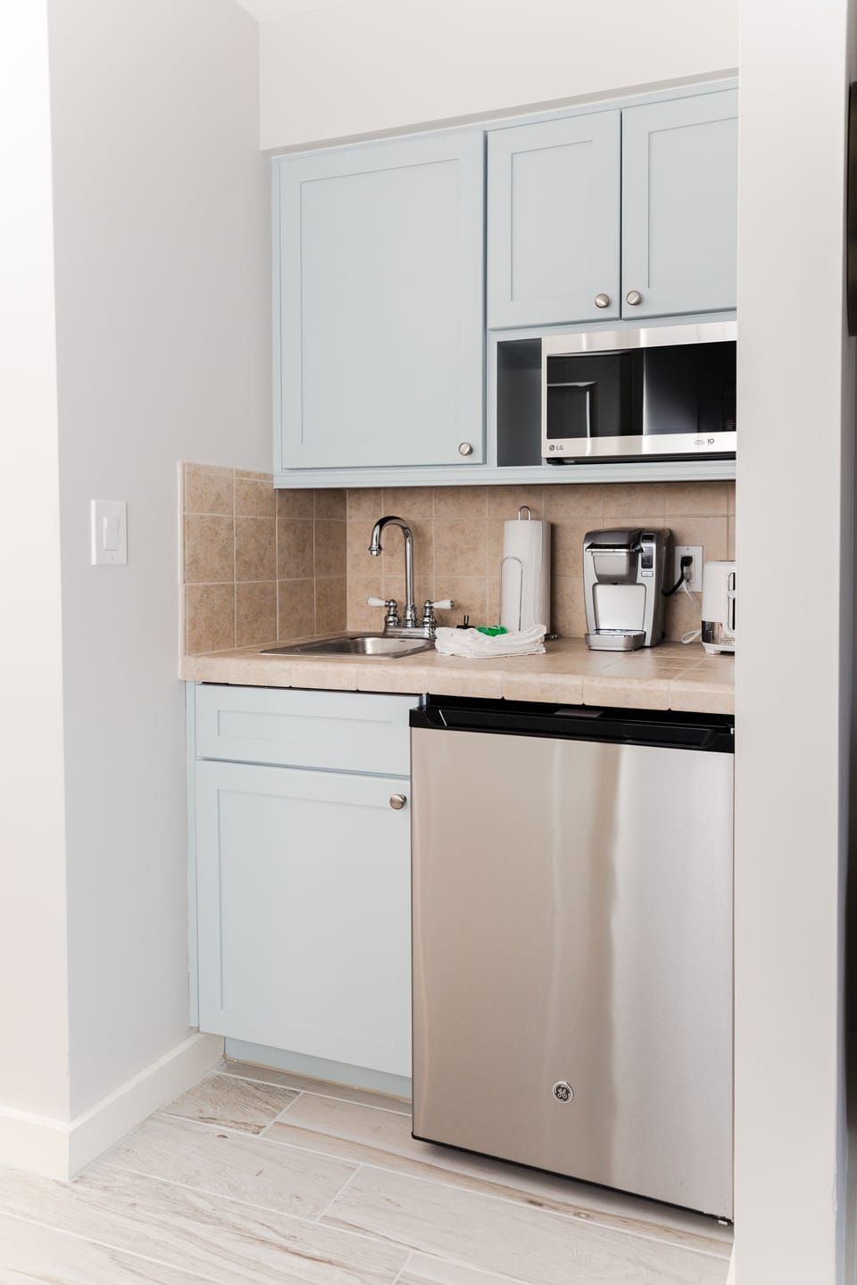 Kitchenette is complete with microwave, toaster, mini-fridge, and Keurig
