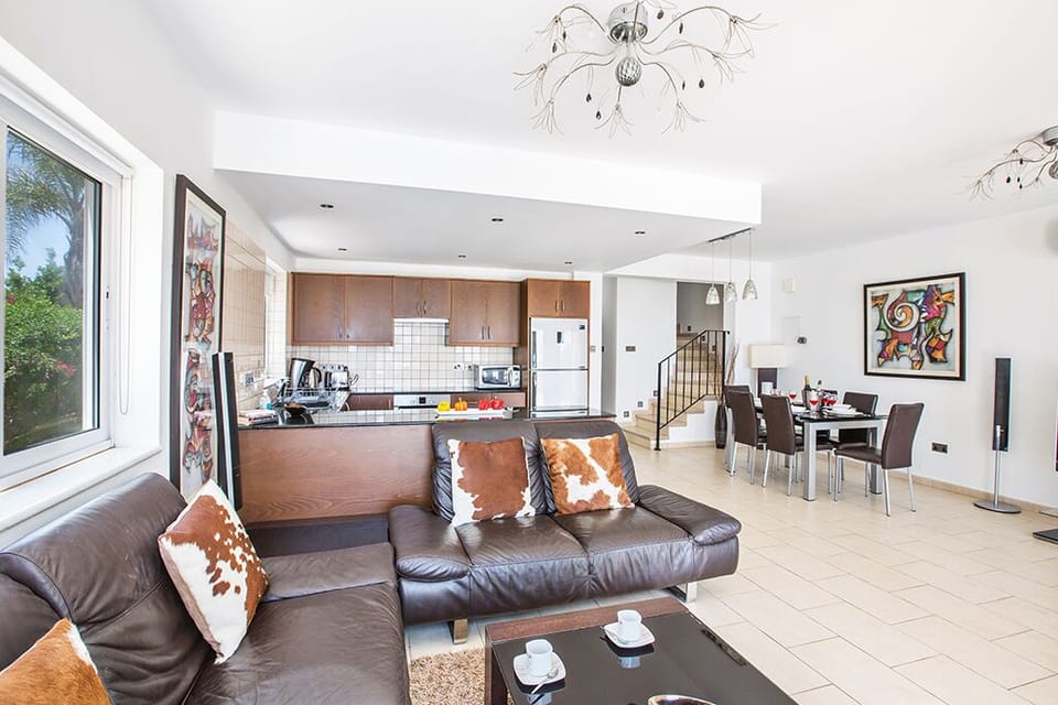 Living room with comfortable sofas, coffee table and widescreen TV