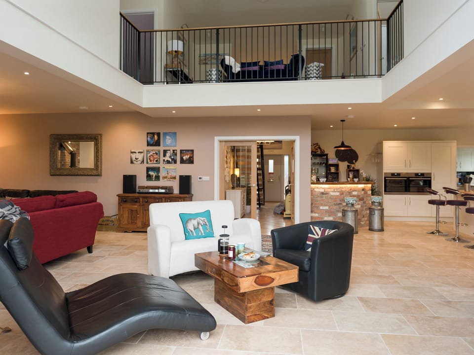 Open plan living space with high vaulted ceilings | The Haybarn - Bedborough Farm Cottages, Wimborne