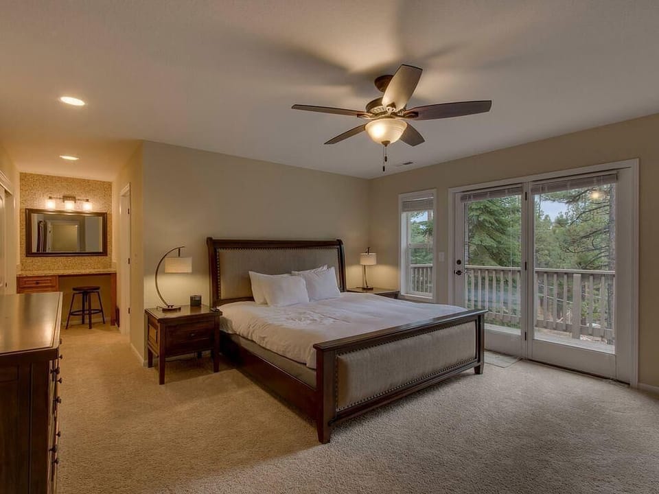 Spacious bedroom with private balcony and cozy ambiance