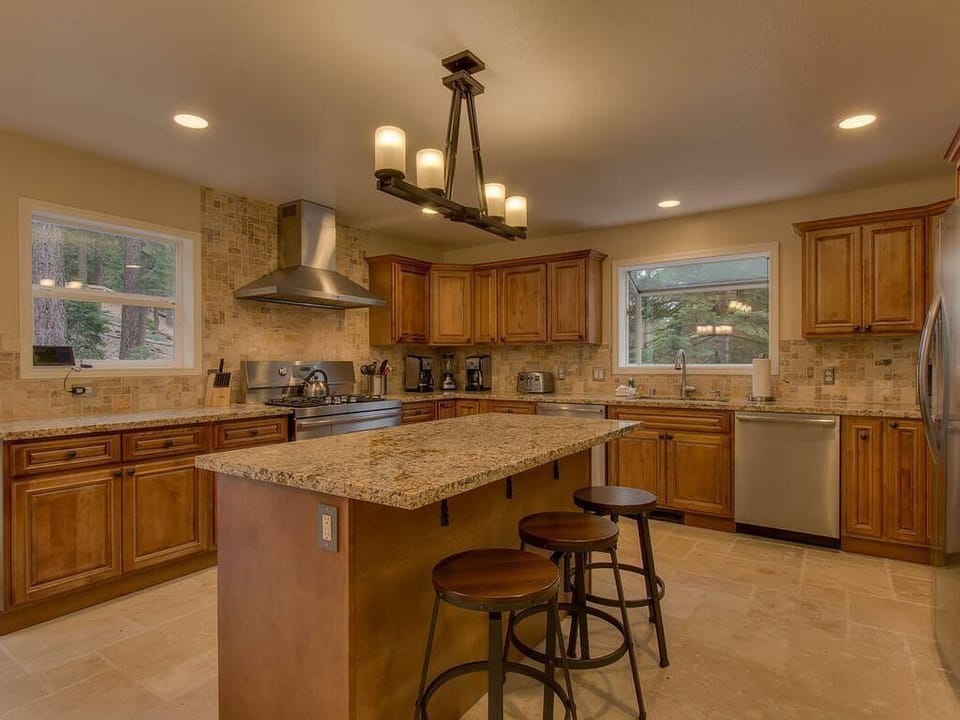 Spacious kitchen with granite island and cozy seating area