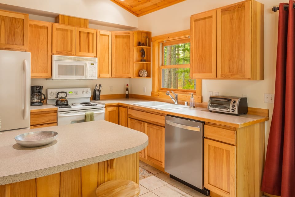 Refrigerator, electric range, microwave, toaster oven and dishwasher.