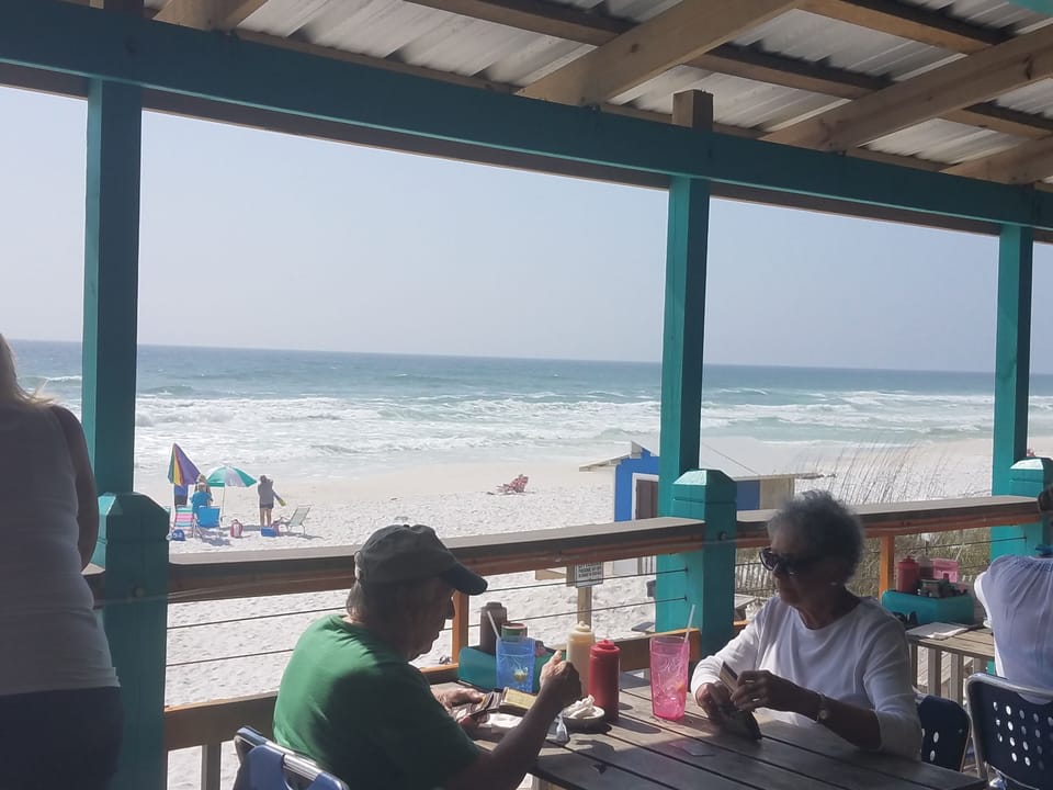 Enjoy one of the  many beach side restaurants like The Backporch