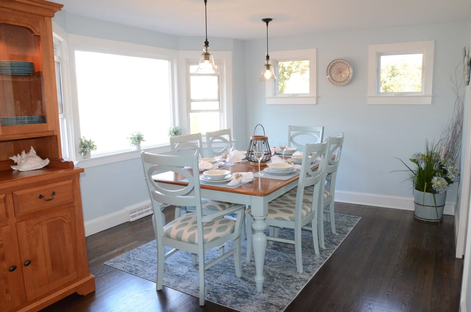 Dining area overlooks the peaceful marsh. Table comfortably seats 8.