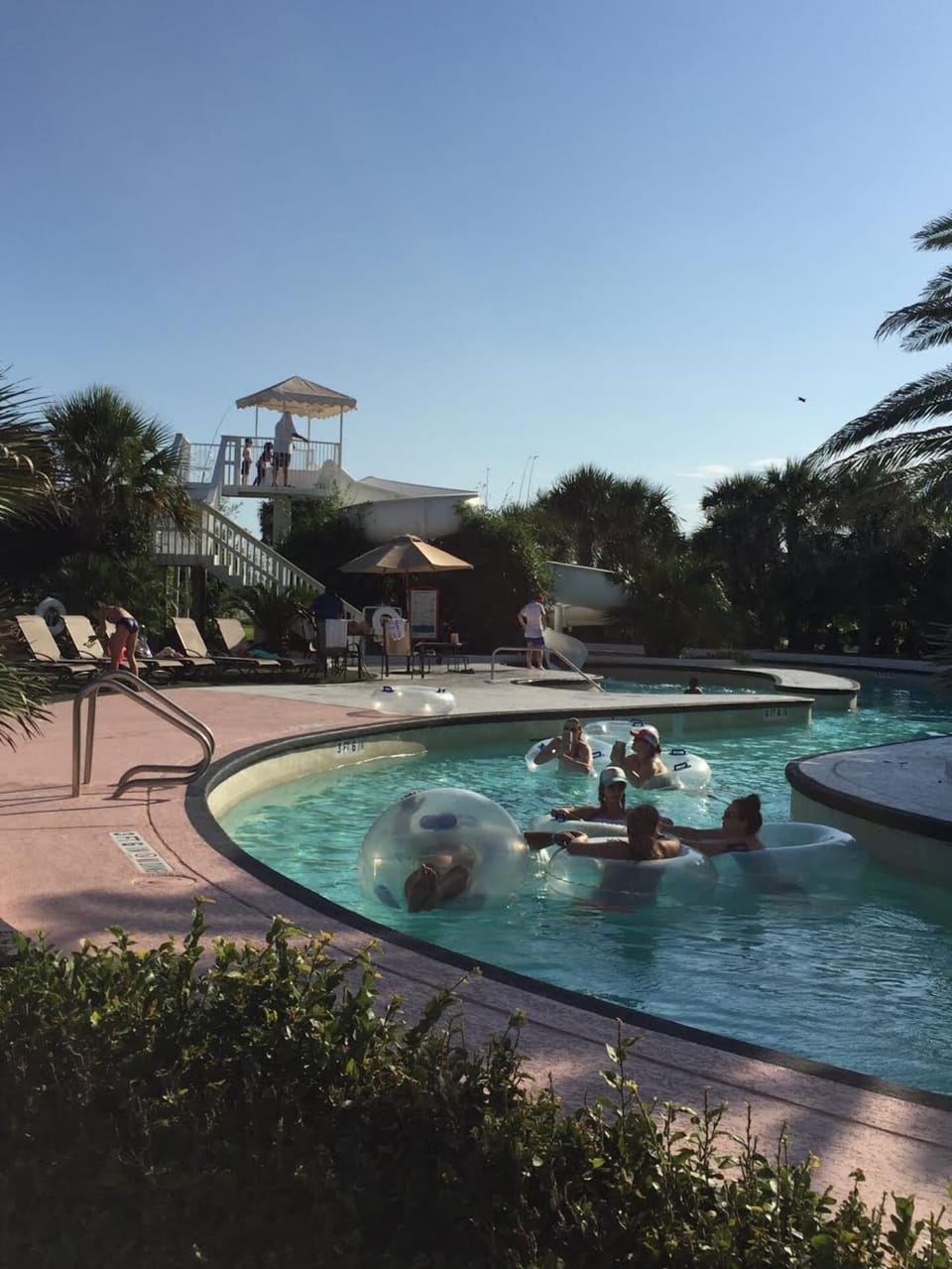 Seasonal lazy river with float-up bar and kid's slide! Grab a tube and float...
