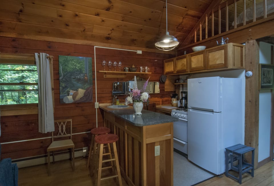 Granite countertop, four-burner gas stove and other kitchen essentials.