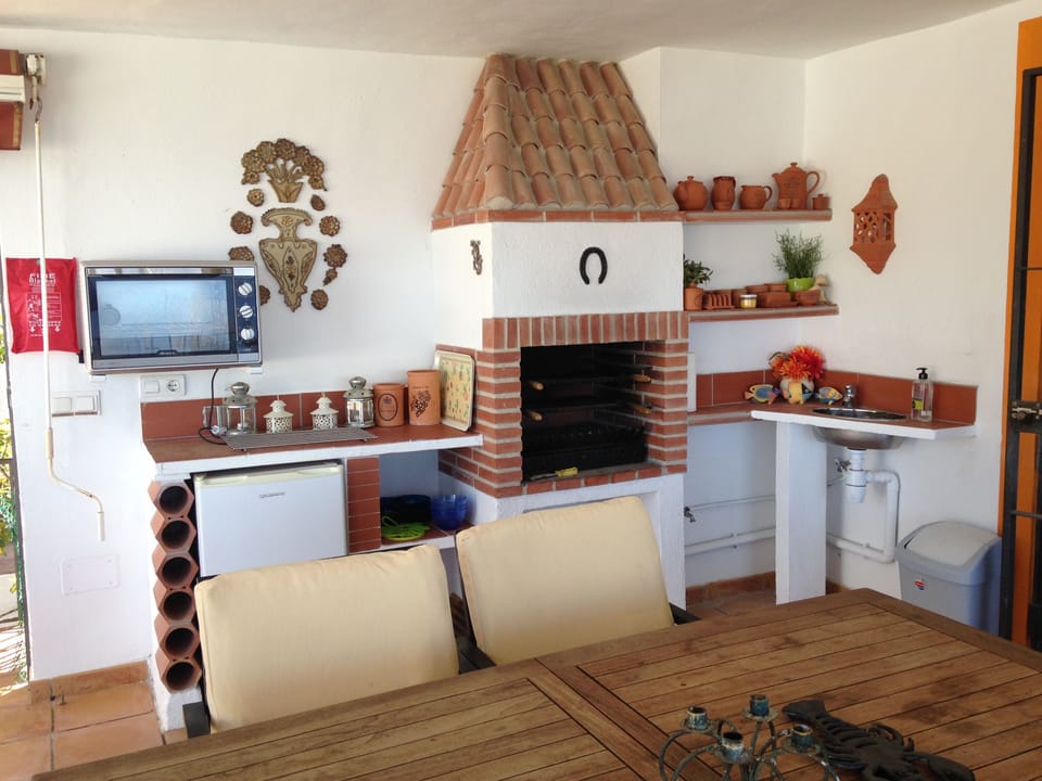 Outside kitchen on covered terrace.