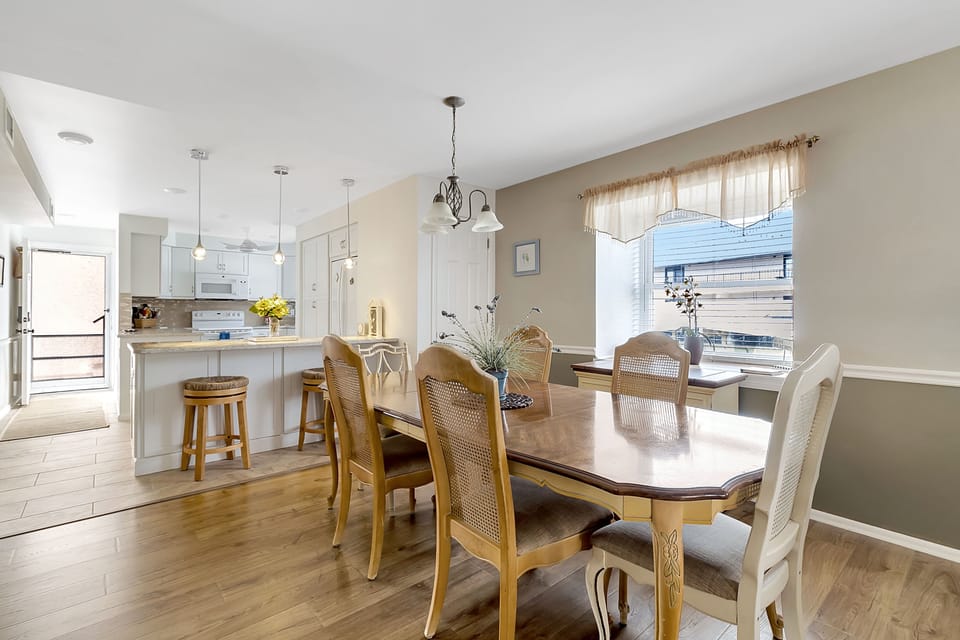 Dining area with table that seats six.