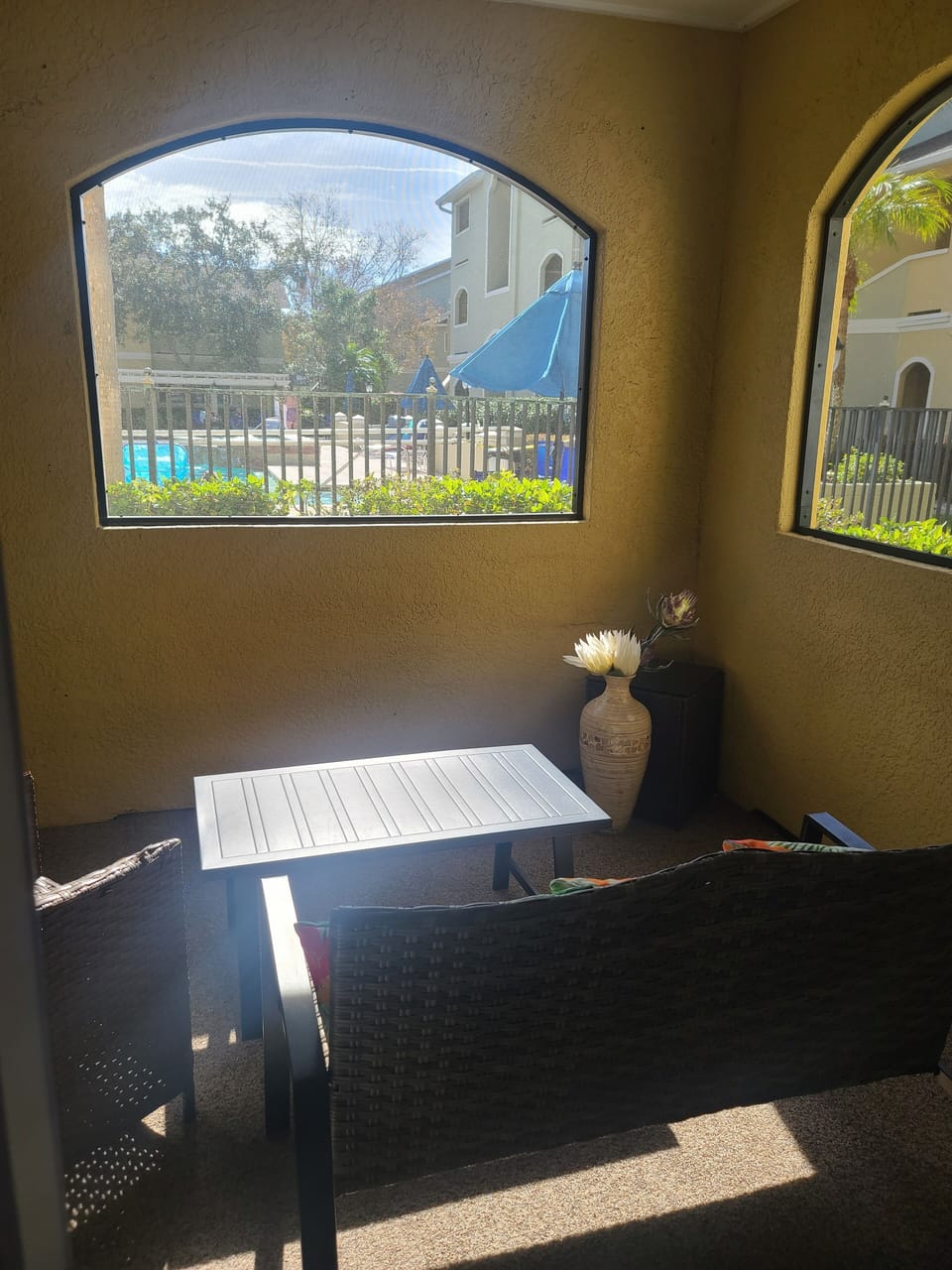view of community pool from the unit