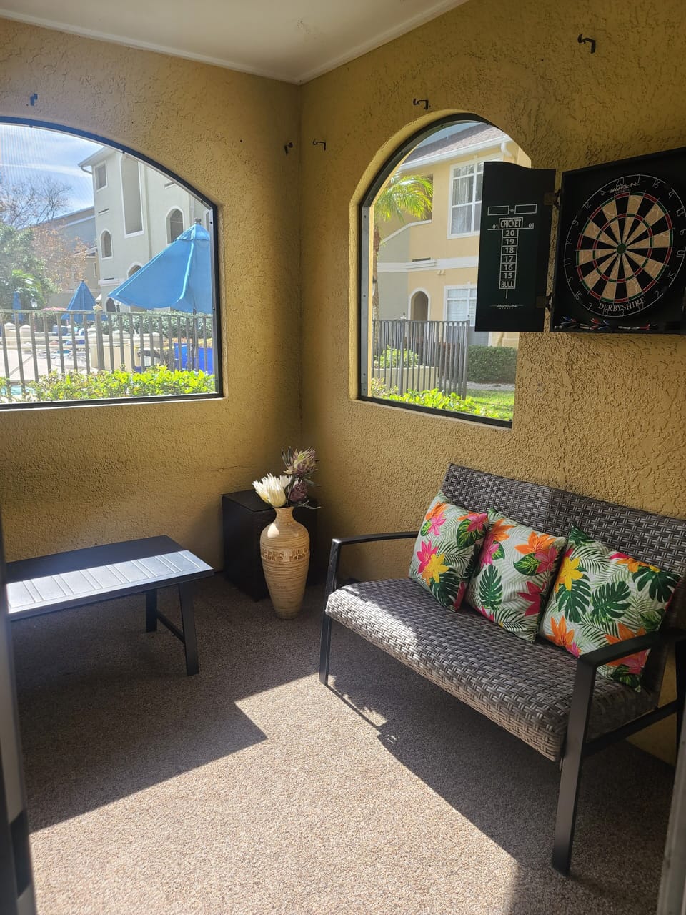 Screen in patio overlooking pool.