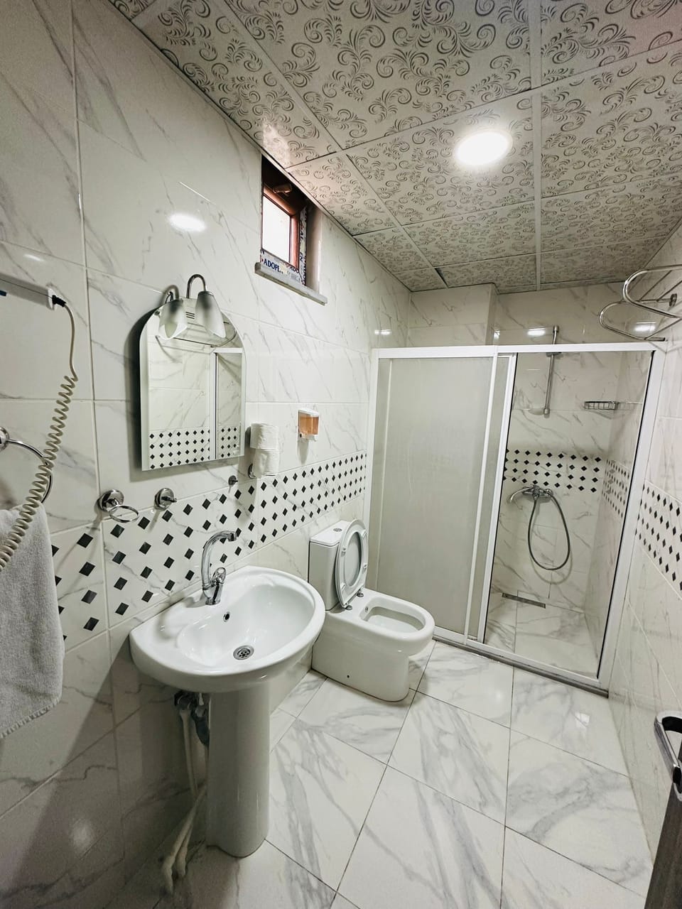 Shower, free toiletries, hair dryer, slippers