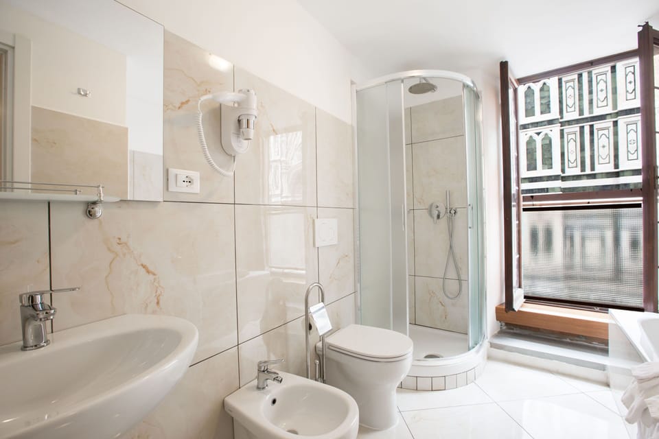 Deluxe Studio Suite, City View | Bathroom | Free toiletries, hair dryer, slippers, bidet