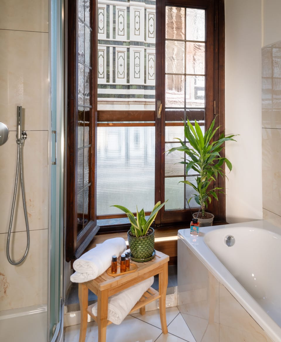 Deluxe Studio Suite, City View | Bathroom | Free toiletries, hair dryer, slippers, bidet