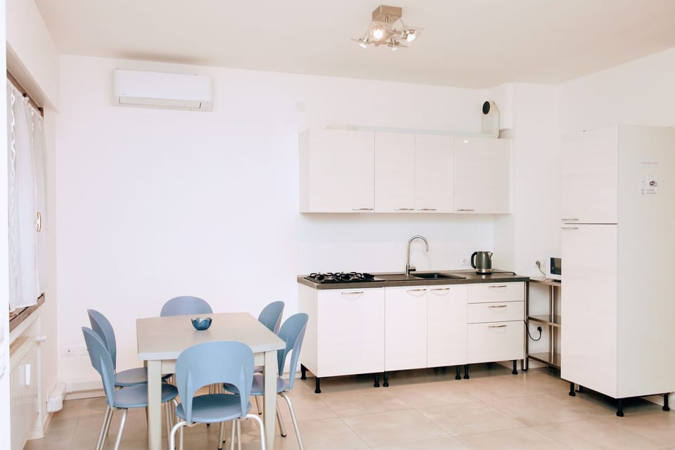 Fridge, stovetop, espresso maker, coffee/tea maker