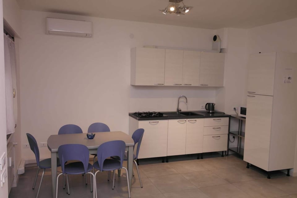 Fridge, stovetop, espresso maker, coffee/tea maker