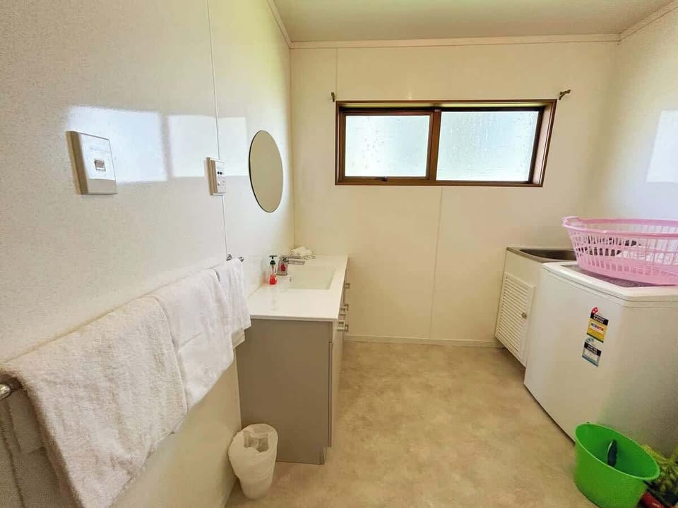 Upstairs bathroom with washing machine