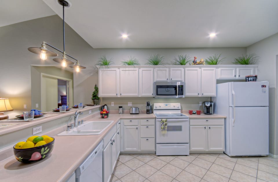 Kitchen cabinets are filled with all the gadgets and conveniences the chef needs.