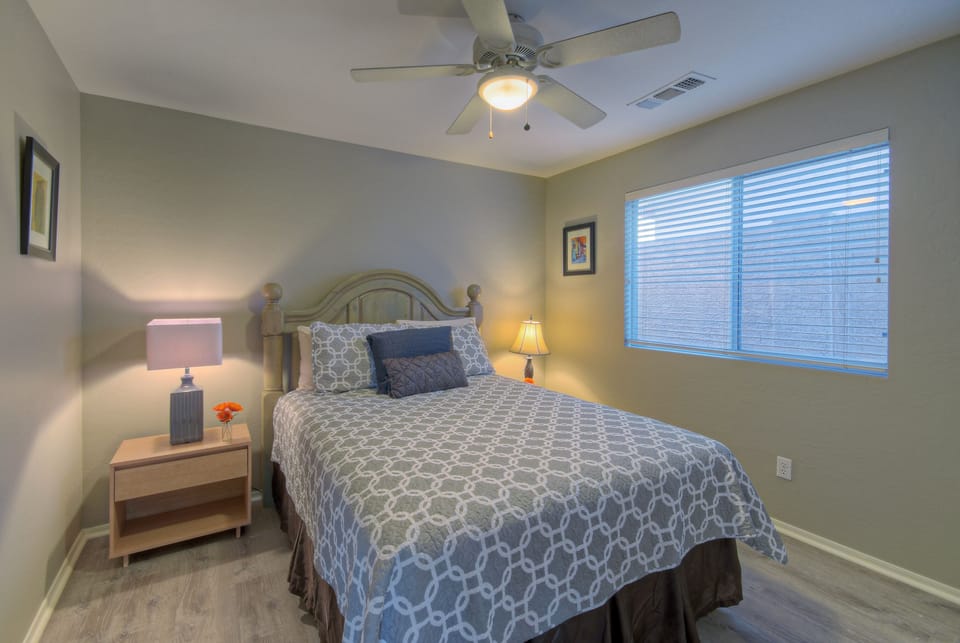 Bedroom 3 is also separated from the primary suite and features a queen bed and television.