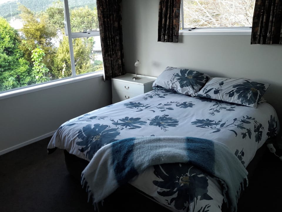 receives morning sun, and has room to add a cot if required.  Blackout drapes