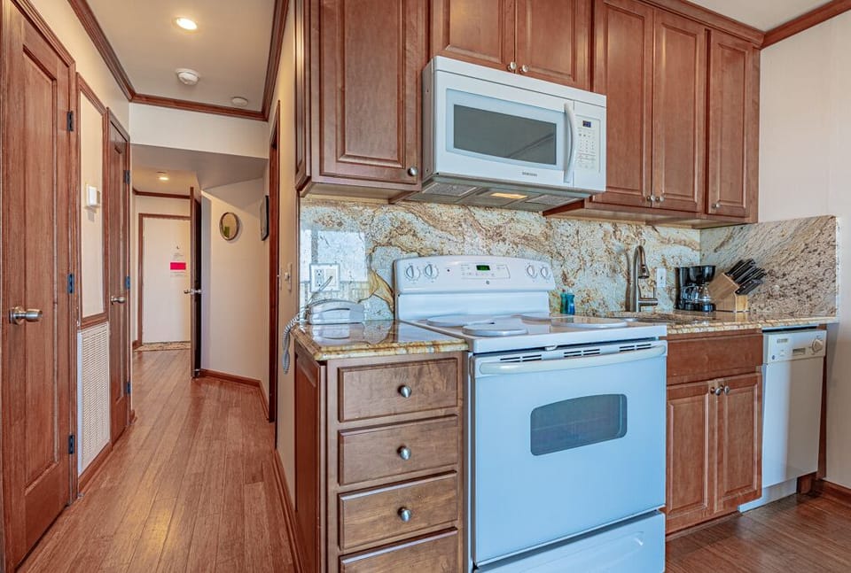 Full-size oven, microwave and apartment size dishwasher.
