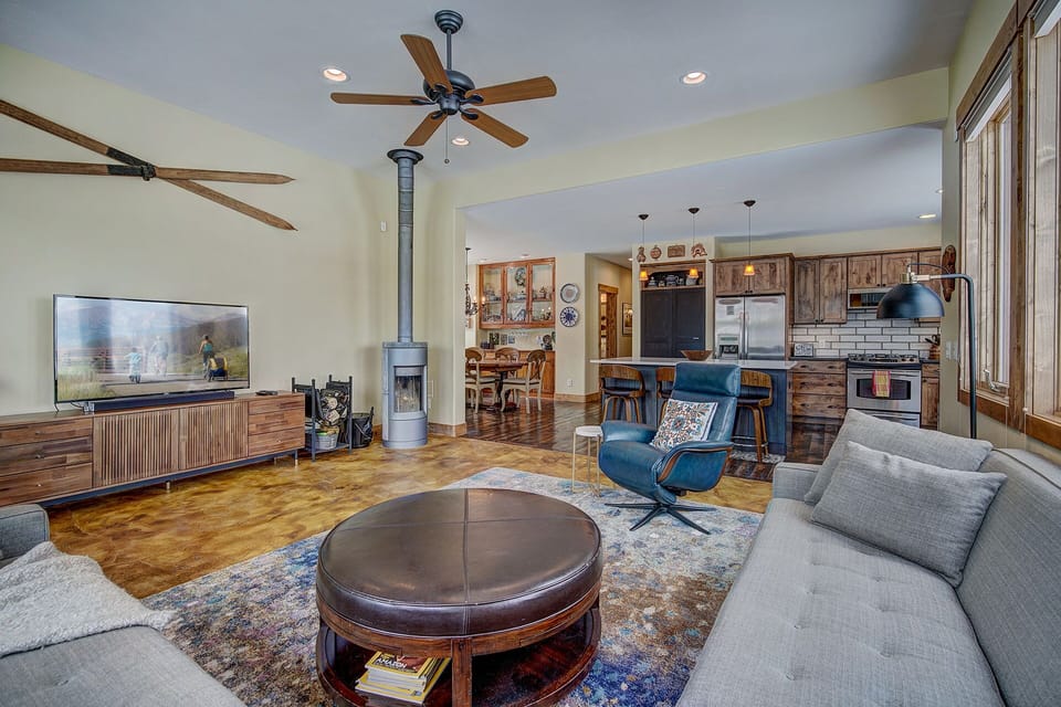 Sun-filled living room with real wood burning stove 