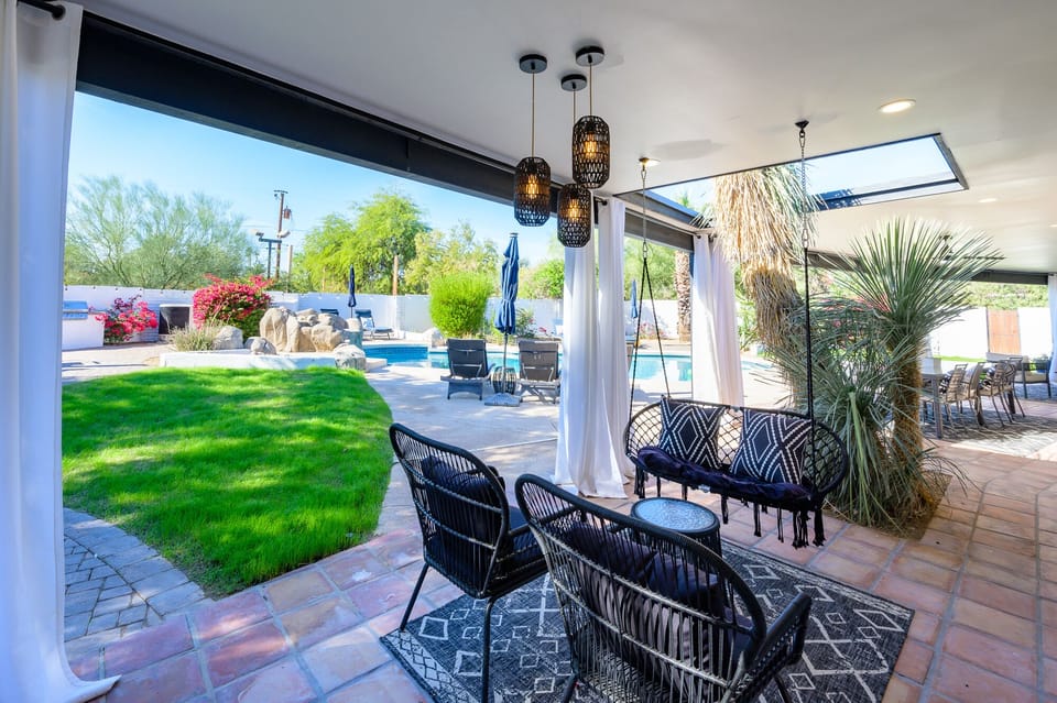 The sitting area is off the kitchen. Rock in the swing with the yucca backdrop!