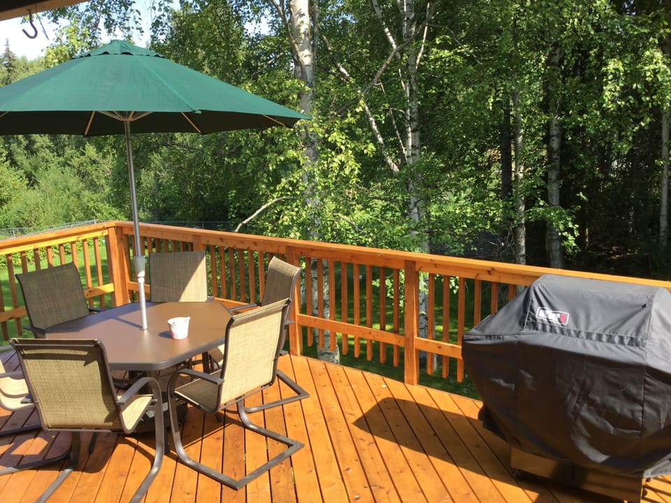 Deck with seating and grill.