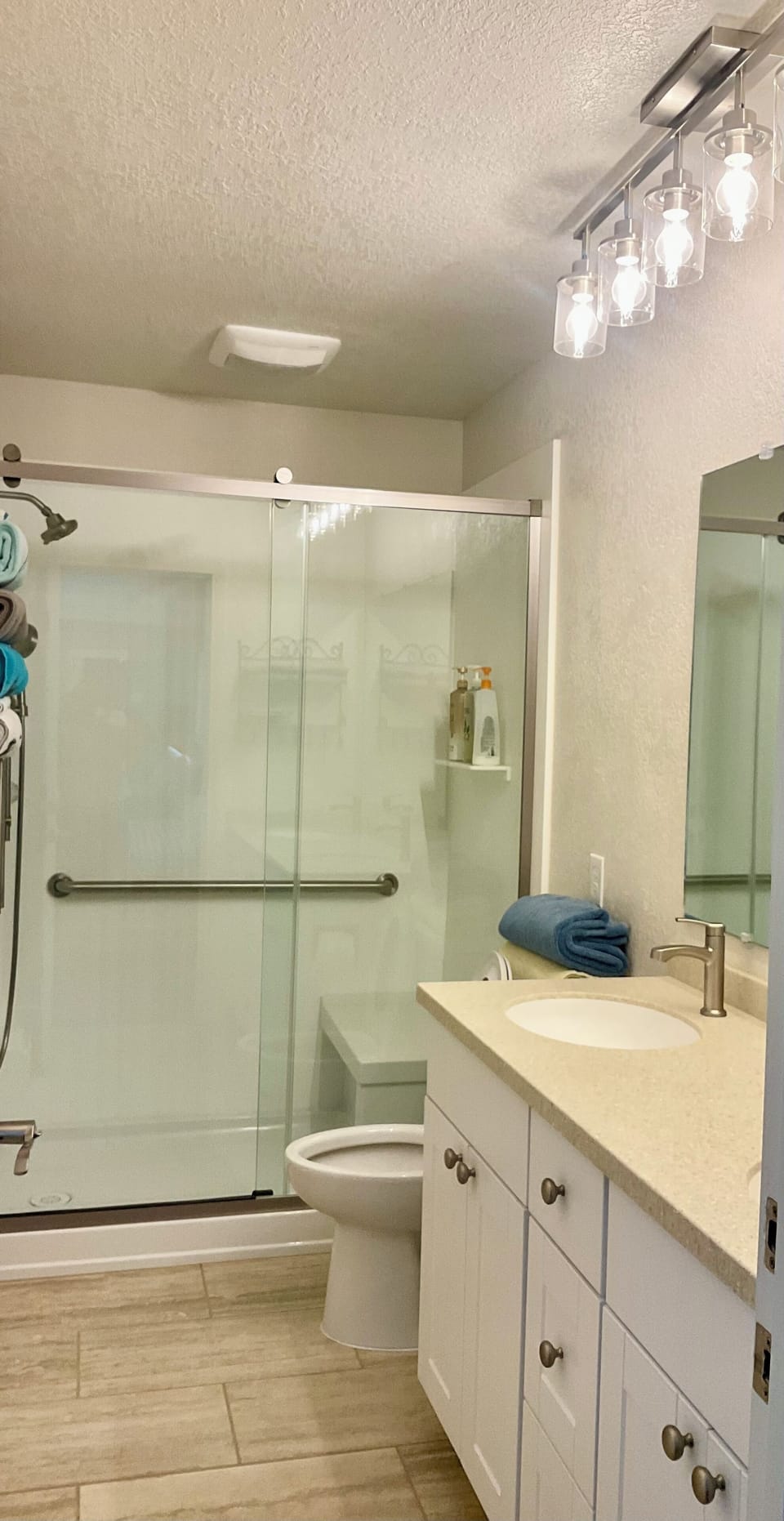 Upstairs bathroom with walk in shower with built in bench