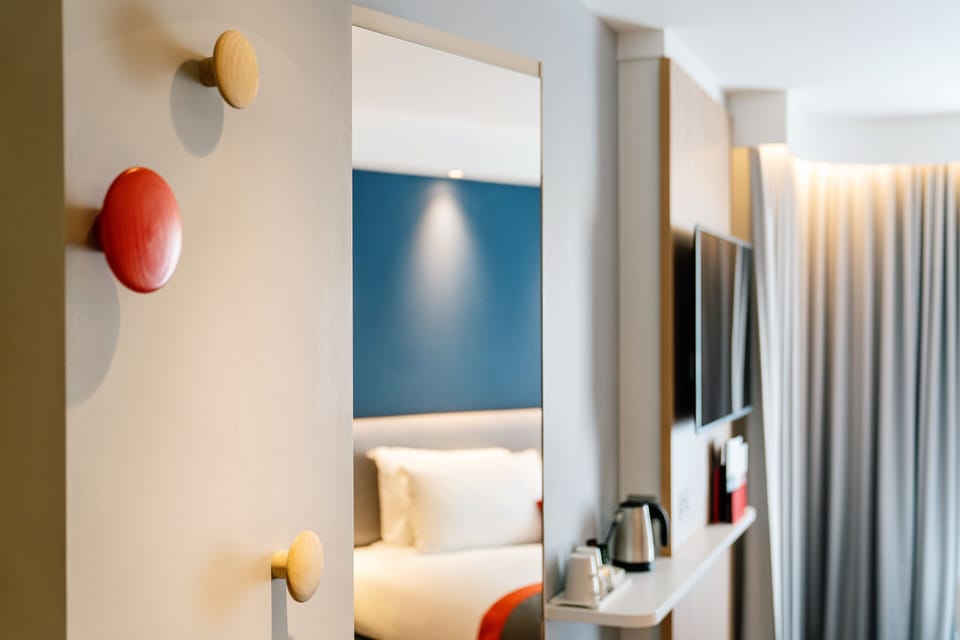 Desk, laptop workspace, blackout drapes, iron/ironing board