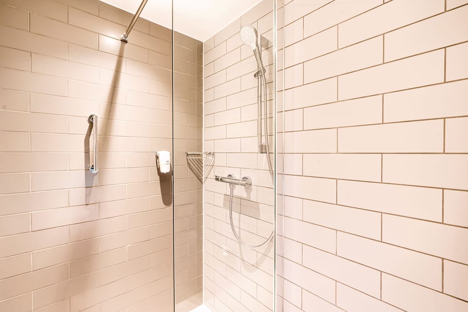 Desk, laptop workspace, blackout drapes, iron/ironing board