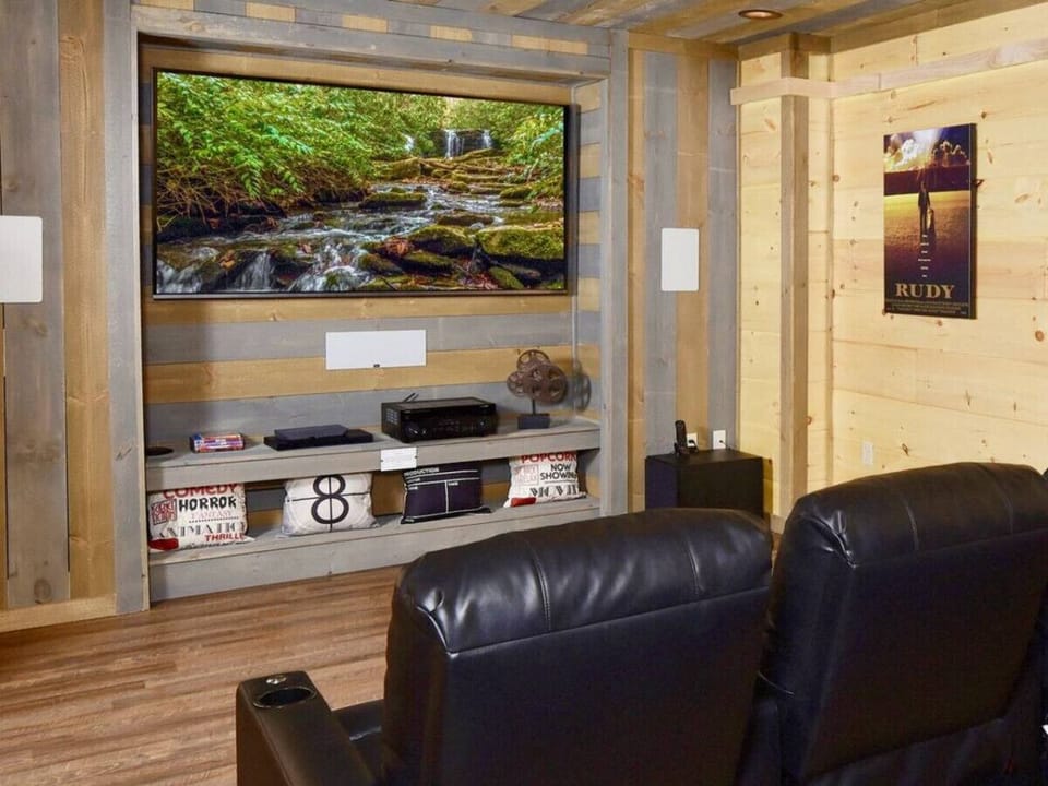 Watch your favorite move or game on the massive 82` HDTV in the theater room.
