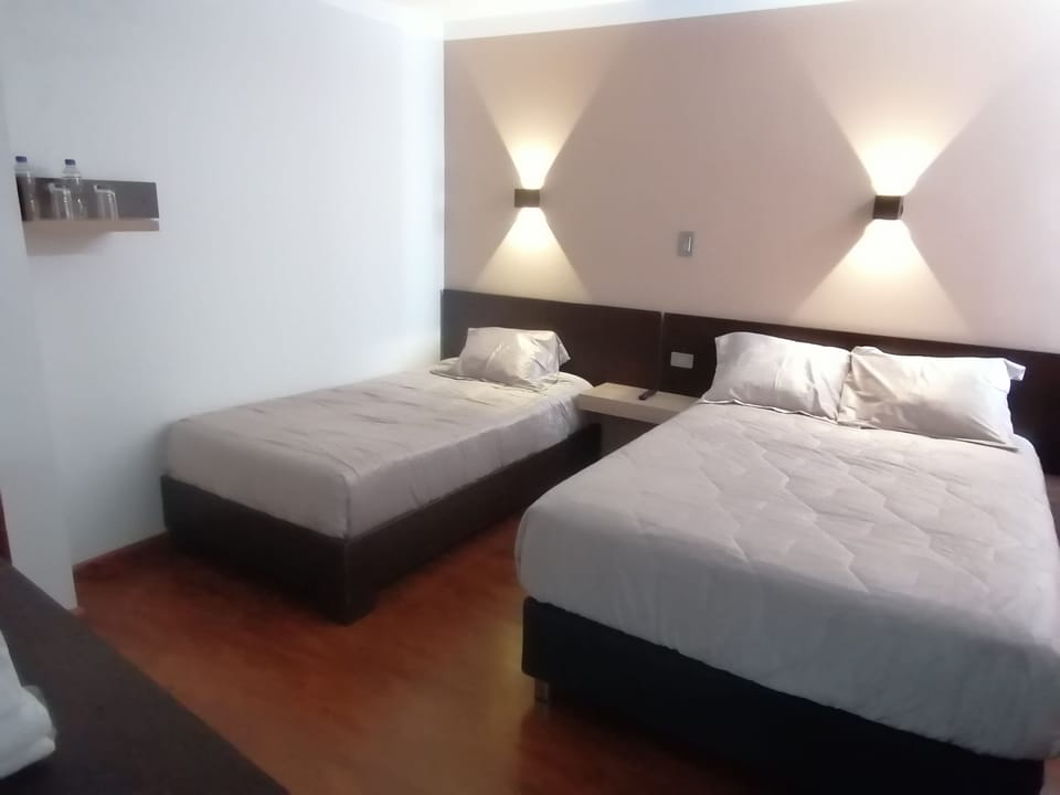 Superior Triple Room, Ensuite, City View | Desk, laptop workspace, blackout drapes, soundproofing
