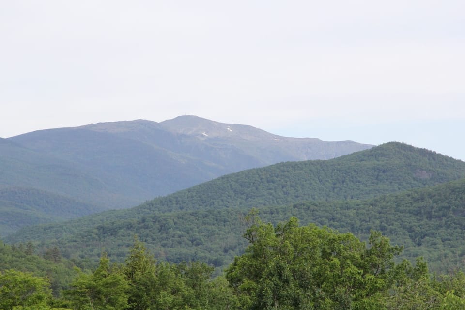 Summer view with traces of snow on Mt. Washington.