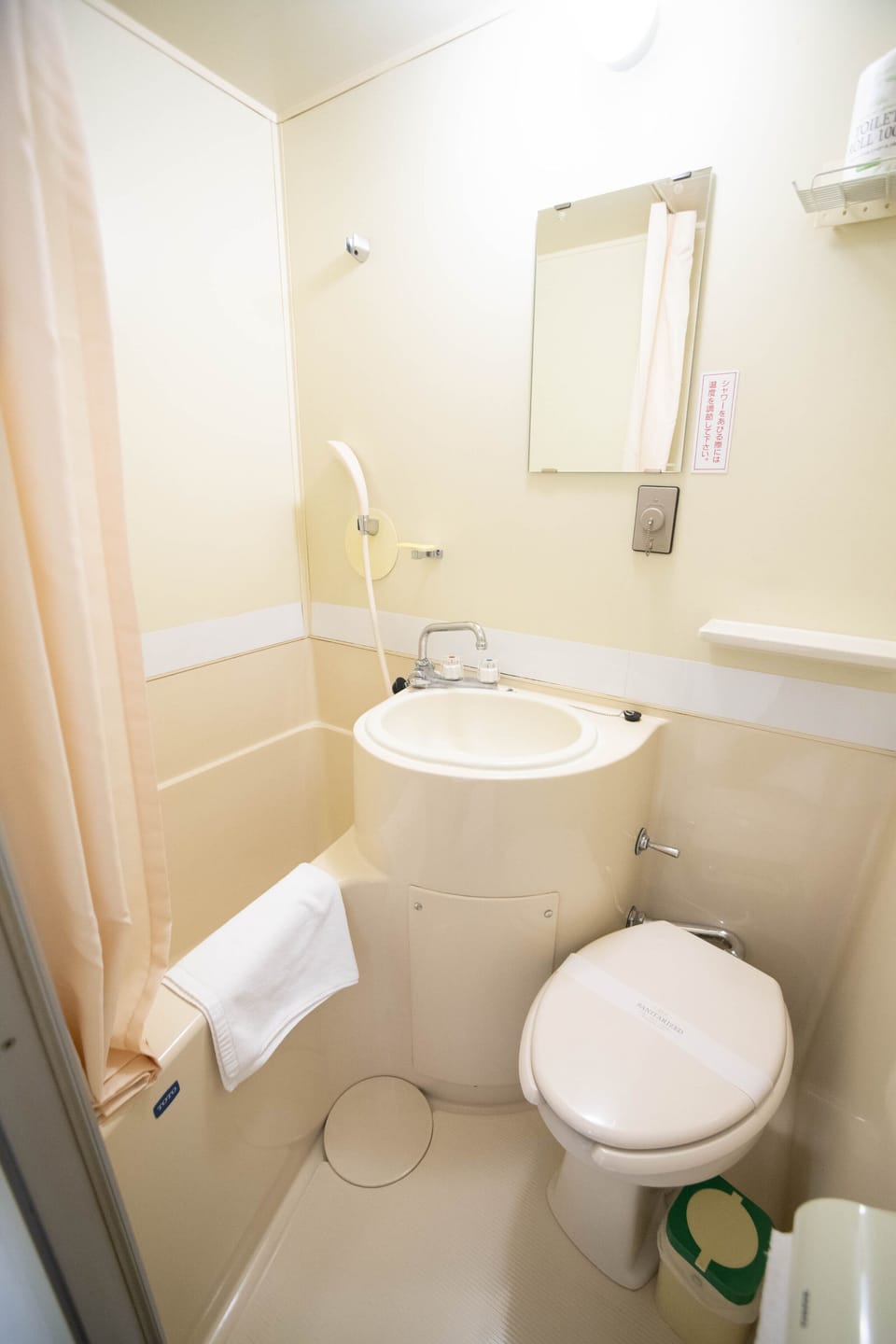 Combined shower/tub, free toiletries, hair dryer, slippers