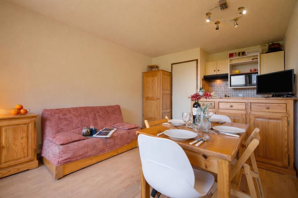 Living room with sofa bed & television