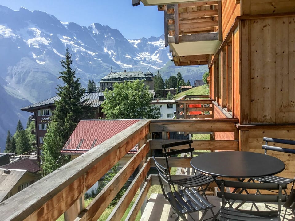 Table, Property, Sky, Building, Mountain, Wood, Neighbourhood, Tree, Roof, Shade