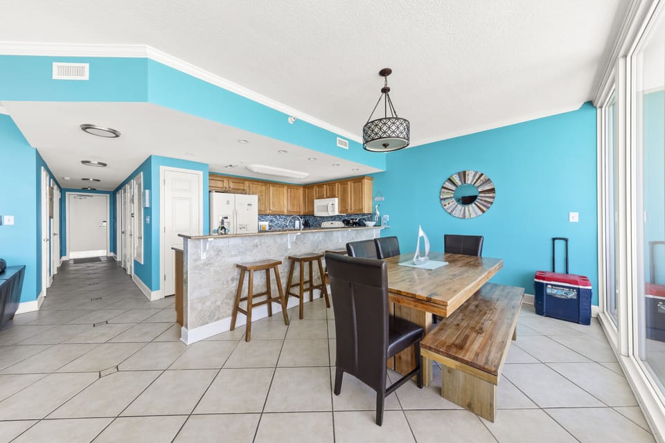 Dining table for 6 and a kitchen bar with 4 stools.
