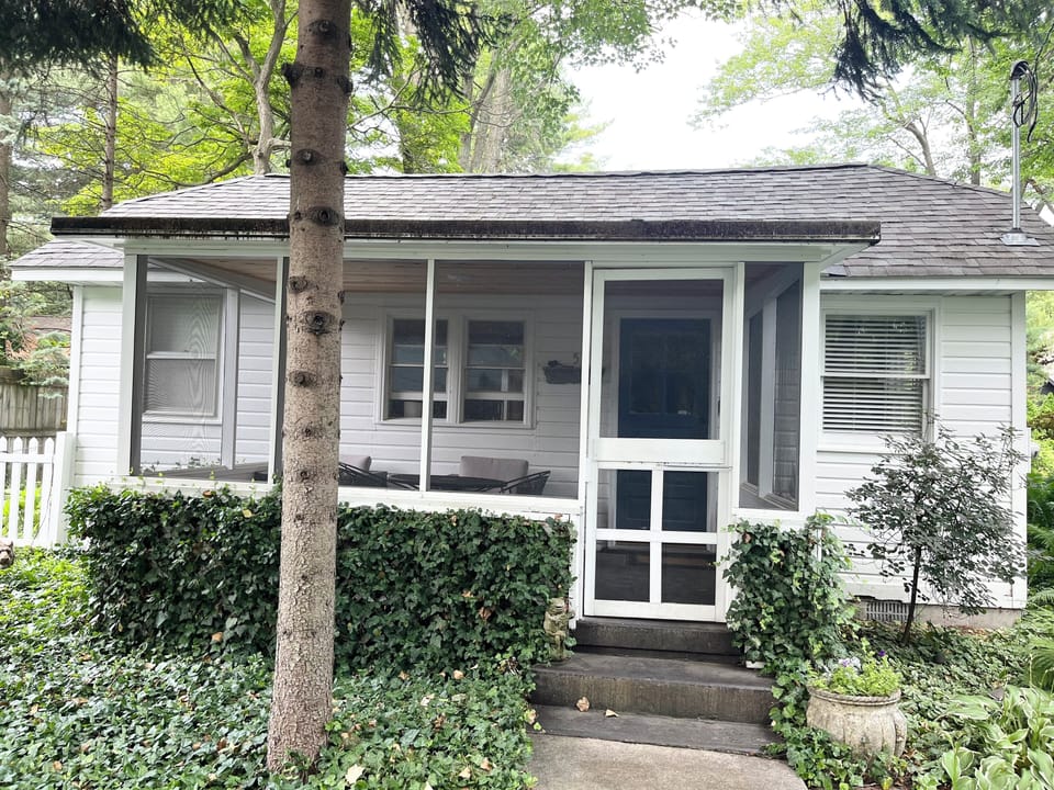 close up of front of Cottage 5 and the screened porch