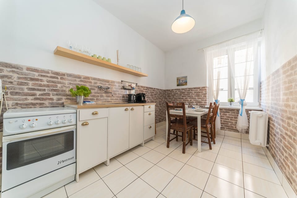 Comfort Apartment, 2 Bedrooms | Private kitchen | Full-size fridge, oven, stovetop, coffee/tea maker