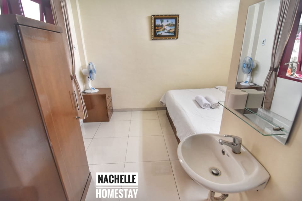 Standard Room, 1 Queen Bed, Private Bathroom | Rollaway beds (surcharge), bed sheets