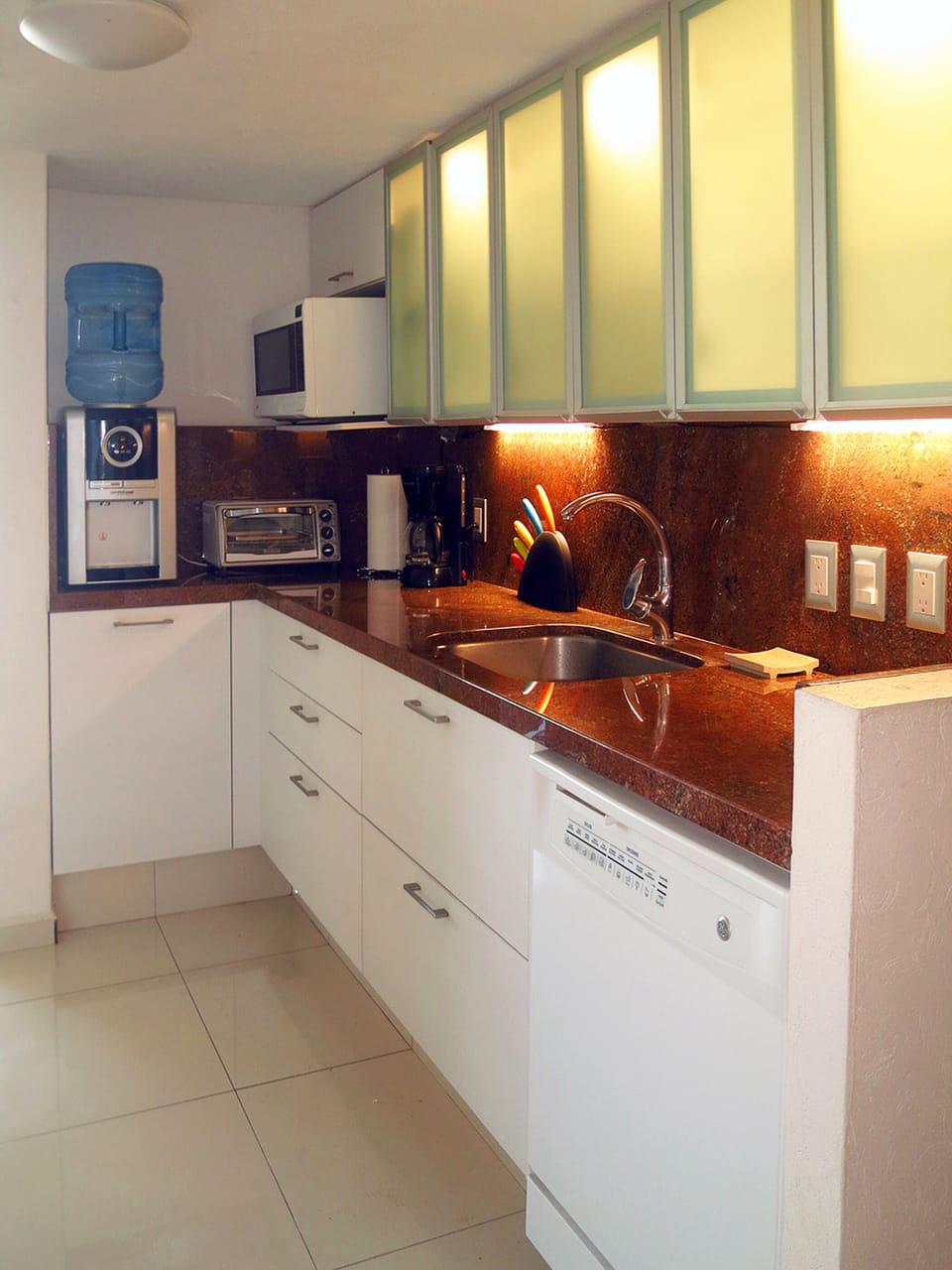 Kitchen with granite counters, dishwasher, and microwave