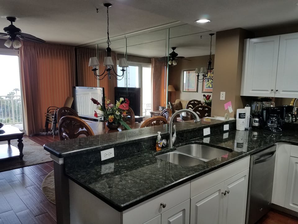 Open floor plan with gulf views from Kitchen and Family Room, Large flat screen 