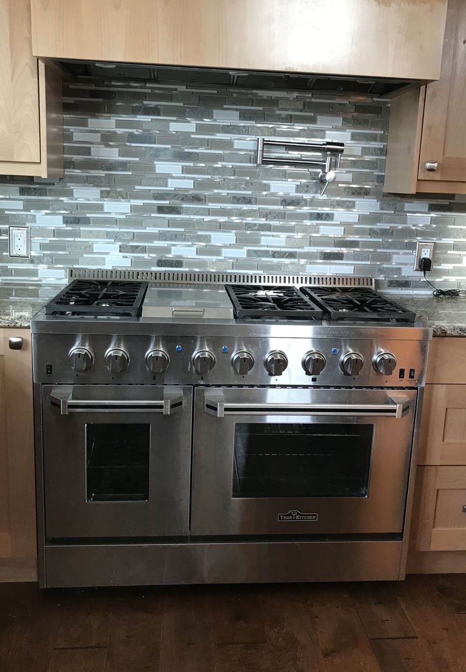 6 burner stove with 2 oven, grill, water spigot and overhead vent