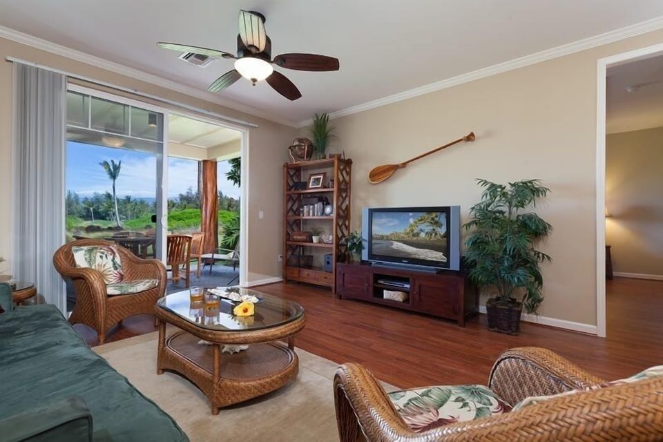 Spacious living room with slider doors to lanai